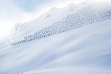Hillside with snow fences for avalanche control.