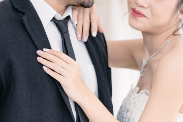 Obraz na płótnie Canvas Groom holding Bride with happyness in wedding suit