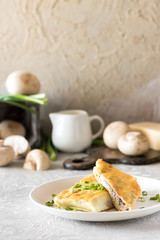 Béchamel baked pancakes stuffed with mushrooms