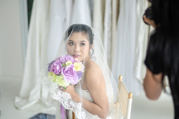 Bride posing with Wedding Photographer