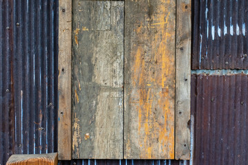 old wooden door or window on metal building