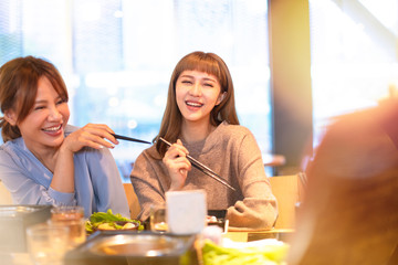 happy asian young Group  eating in the restaurant
