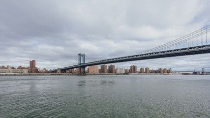 Manhattan skyline viewed from Brooklyn with Manhattan bridge, in New York City, USA