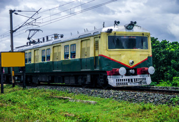 Fototapeta na wymiar Indian Train Running Over The Train Tracks.