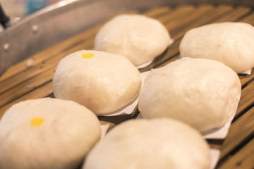 steamed stuff buns .warming up in a big pot, look round beautiful tasty