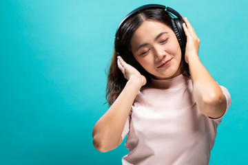 Happy woman dancing and listening to the music