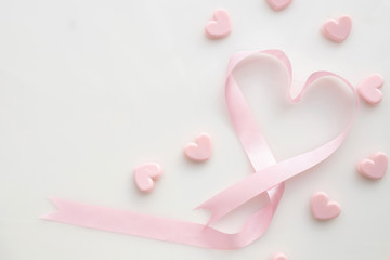 pink ribbon heart shape on isolated white background, Velentine's day Background.