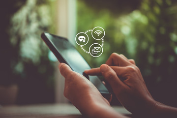 Woman hand using smartphone or tablet to do business, financial or trading stock forex market in...