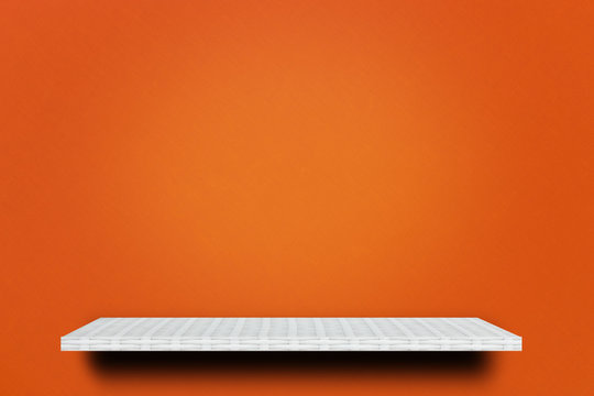 Empty White Shelf On Orange Background For Product Display