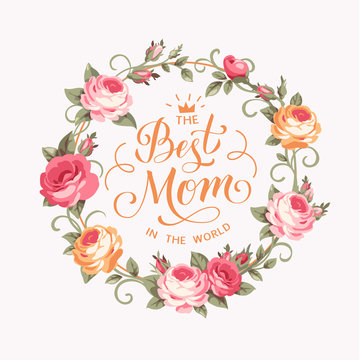 The Best Mom in the world. Calligraphic greeting text with pink roses. Vector illustration.
