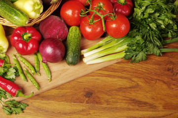A variety of delicious vegetables on the kitchen board. Copy space. 