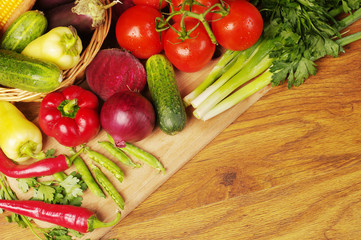 A variety of delicious vegetables on the kitchen board. Copy space. 