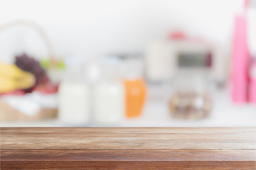 Empty wood table top and blurred kitchen interior background - can used for display or montage your products.