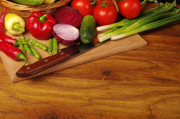 A variety of delicious vegetables on the kitchen board. Copy space. 