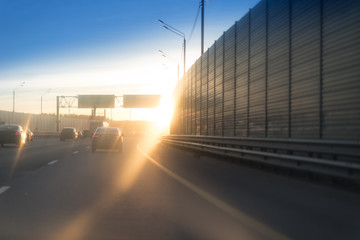 good sunset and asphalt road with metal safety and big noise or sound barrier