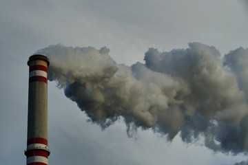Dark smoke from chimney of coal power plant causing global warming, carbon dioxide co2 emissions