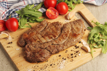 A beef steak well done with vegetables