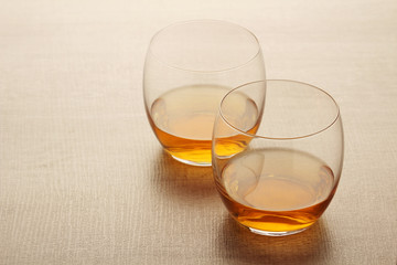 Two glasses with whiskey without ice cubes	