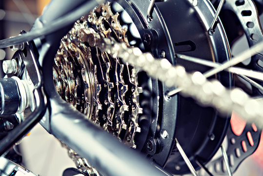 close up of  bicycle gear and black electric motor