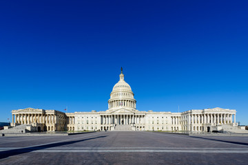 Fototapeta premium Panoramic view of The United States Capitol building in the morning with blue sky, Washington DC