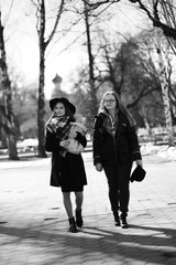 Black and white photo of a young girl on a walk