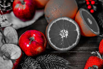 fruits on wooden background. Citrus fruits in rustic background ,oranges, strawberries , mandarins, clementines , apples . Healthy eating and dieting concept. Winter assortment