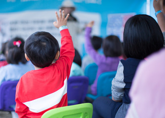 School Children in Classroom Raising Their Hand. Teacher Calling on Students. Teacher teaching a lesson in class. Kids Go on a Field Trip. Question and Answer Session in Asian Elementary School. 