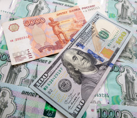 Dollars and Russian rubles on the table as background
