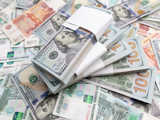 Dollars and Russian rubles on the table as background