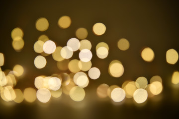 Abstract bokeh background of defocused lights. Merry Christmas and New Year background. Holiday glowing background and wallpaper. Blurred Bokeh.