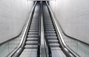 empty long escalator in a train station