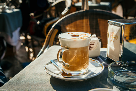 Cappuchino on a cafe table outdoor photo