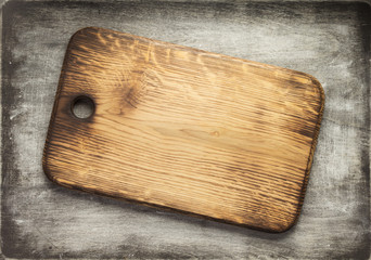 cutting board at old wooden table