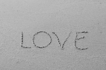 love message written in sand background
