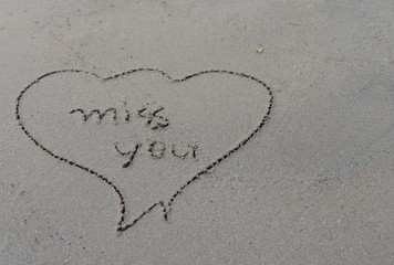 love message written in sand background