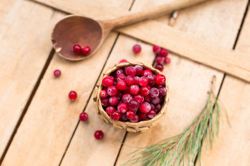 Cranberries, Siberian wild berries, wooden background, rustic style