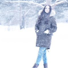 Beautiful girl in a beautiful winter snow