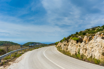 Greece, Zakynthos, Curved road through green paradise to mountain village near Agalas
