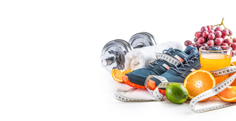 Sport shoes dumbbells fresh fruit measure tape and multivitamin juice isolated on white background. Healthy sport and diet concept. - obrazy, fototapety, plakaty