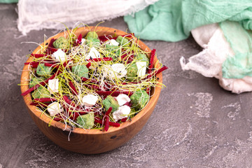 Unusual salad with beetroot, feta cheese, leek sprouts and sesame