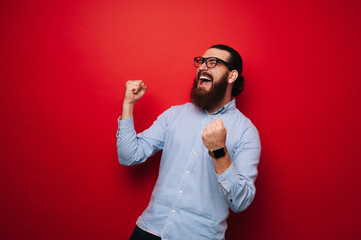 Photo of screaming bearded boy, celebrate his winn
