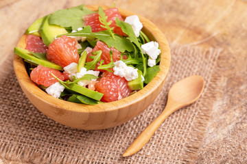 Tasty salad with grapefruit, spinach, feta, avocado and pomegranate