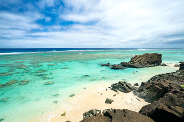 Fototapeta na wymiar Black Rock Beach in Rarotonga in the Cook Islands