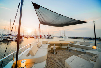View of harbor with yachts details. Beautiful sunset sky in the marina bay.