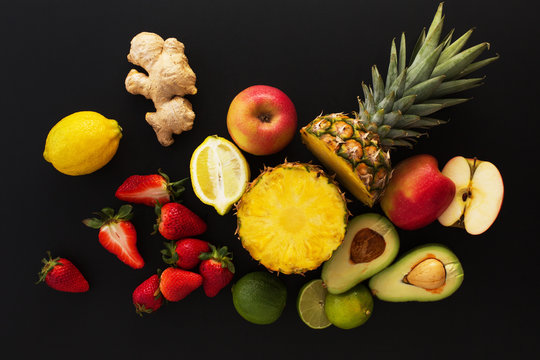 Fruits on black background. Healthy eating concept