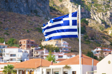 Greek flag against town