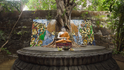 Statue of the Buddhist God Buddha in the Buddhist temple Brahma Vihara Arama with statues of the...