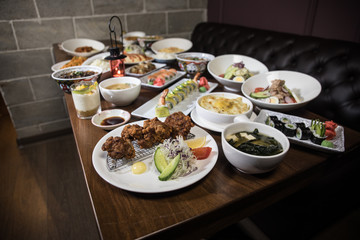 Close up view of plate with japanese food inside. Japan traditional food on wooden table.