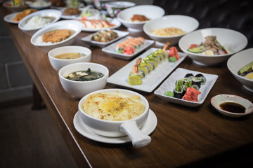 Close up view of plate with japanese food inside. Japan traditional food on wooden table.