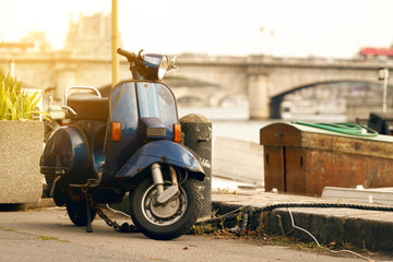 Scooter parked in front of river